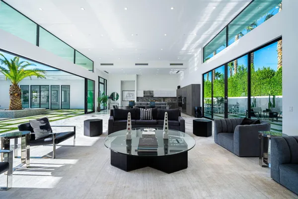 a living room with fireplace furniture and a flat screen tv