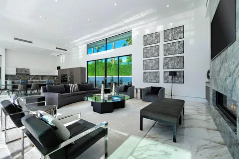 a living room with a fireplace and a flat screen tv