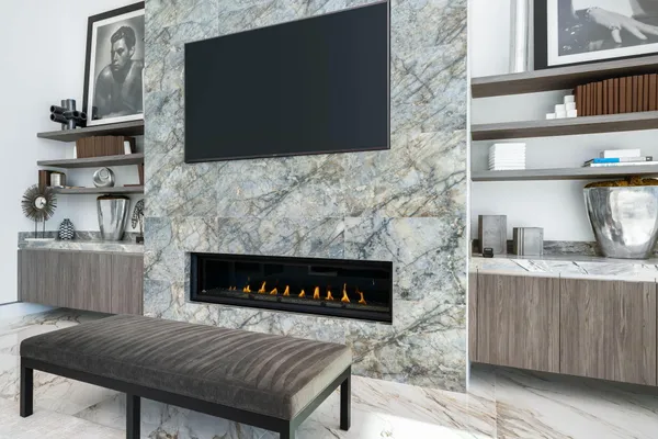 a kitchen with stainless steel appliances kitchen island granite countertop a kitchen island and chairs in it