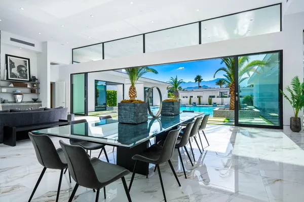 a view of a dining room with furniture window and outside view