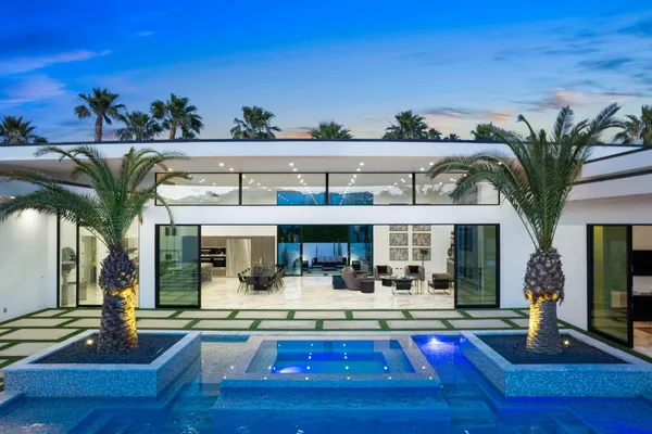 a front view of a house with swimming pool