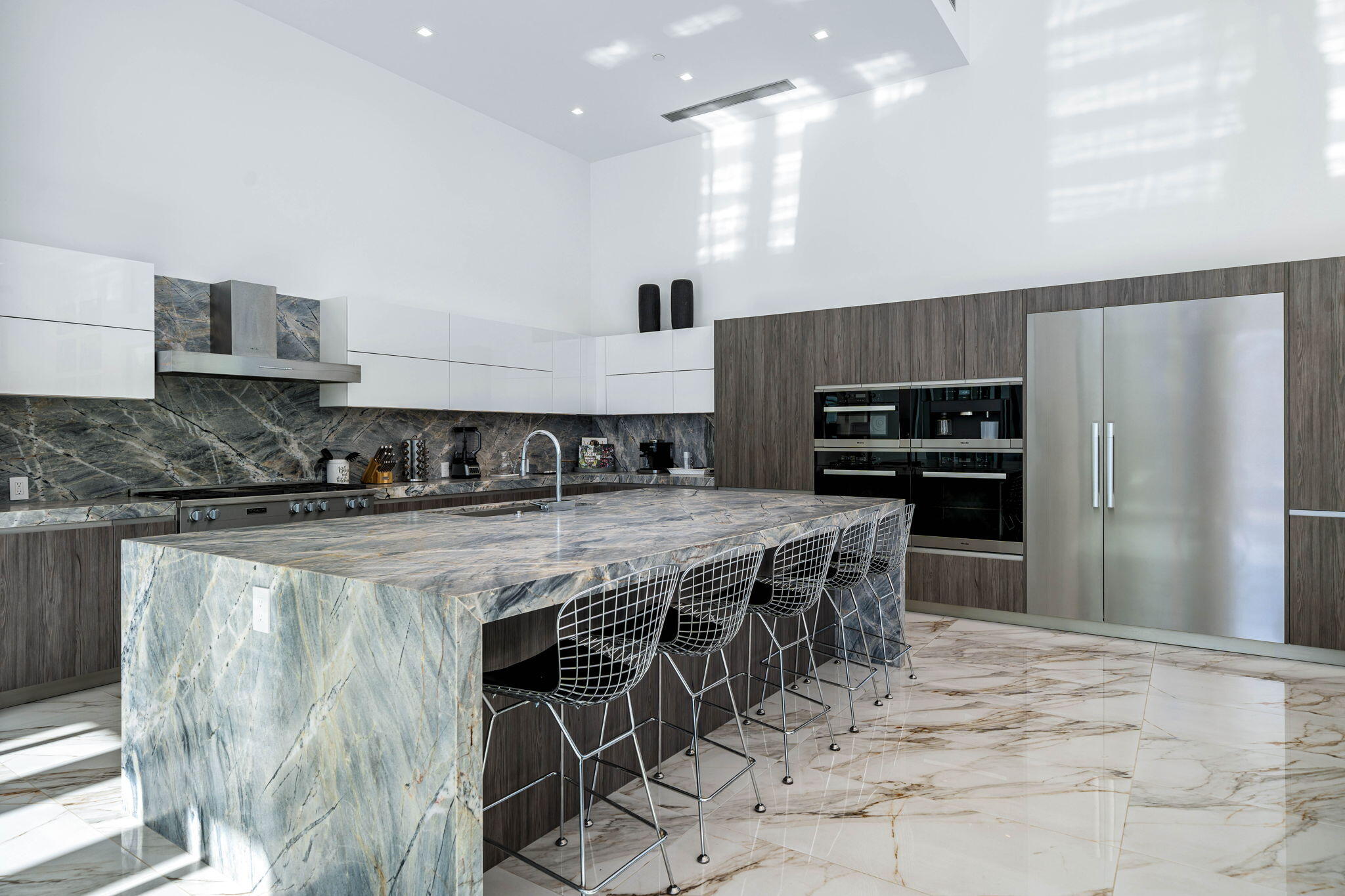 4 Bravo Court Rancho Mirage, CA 92270 - Photo 23 of 51 a kitchen with stainless steel appliances granite countertop a stove top oven a refrigerator and a sink