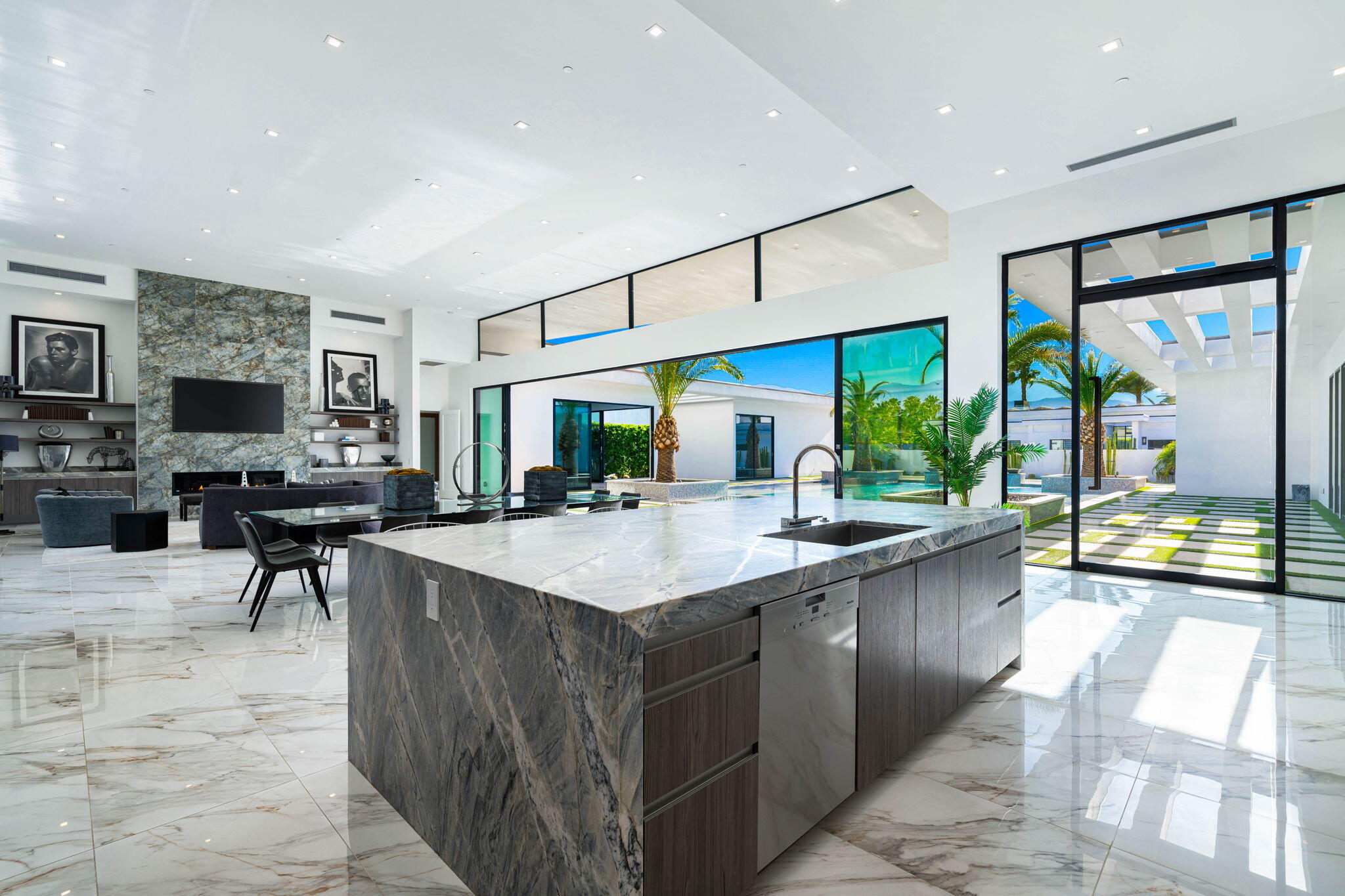 4 Bravo Court Rancho Mirage, CA 92270 - Photo 26 of 51 a large kitchen with stainless steel appliances a large counter top a stove and a sink