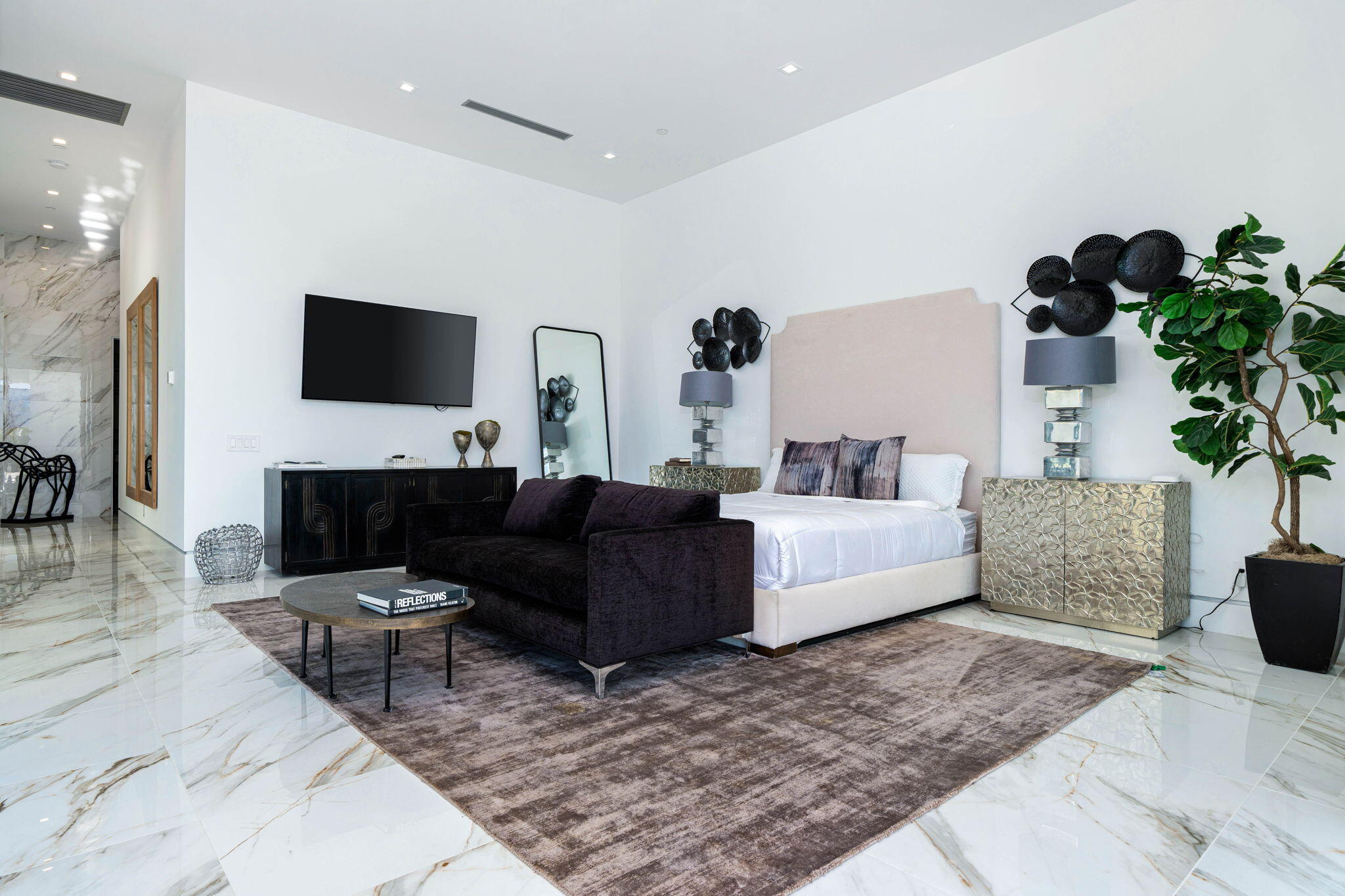 4 Bravo Court Rancho Mirage, CA 92270 - Photo 29 of 51 a living room with furniture and a flat screen tv