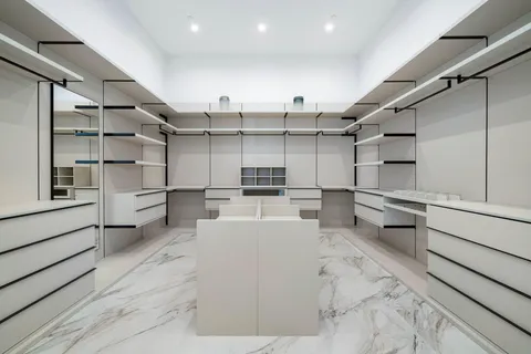 a bathroom with a double vanity sink mirror and