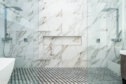 a bedroom with a bed a couch and painting on the wall