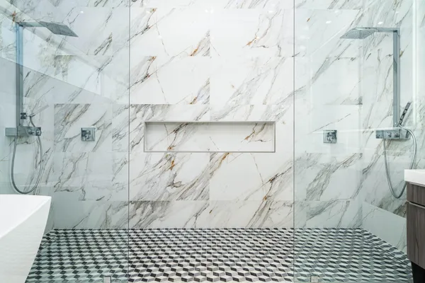 a bedroom with a bed a couch and painting on the wall