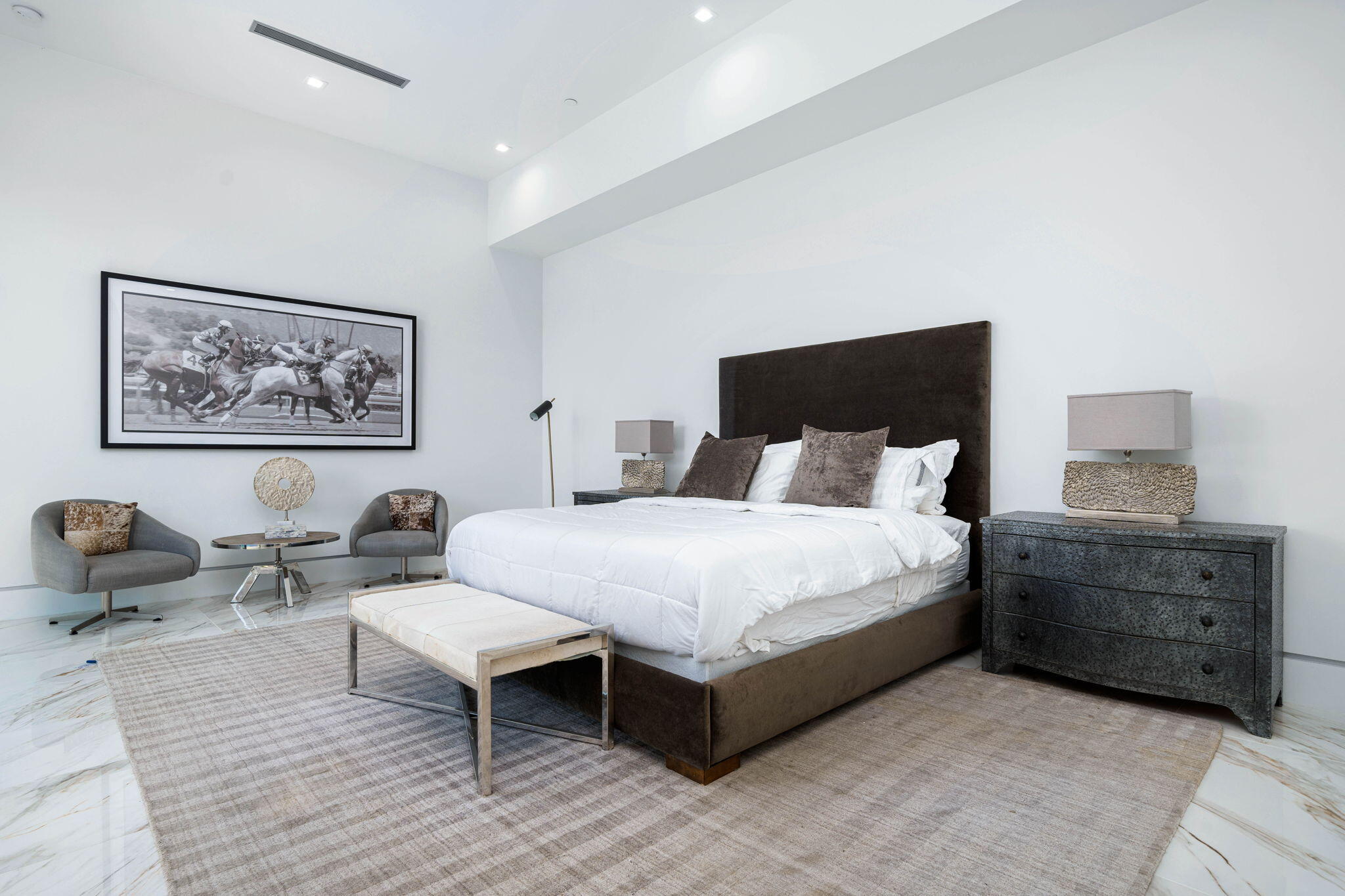 4 Bravo Court Rancho Mirage, CA 92270 - Photo 34 of 51 a bedroom with a bed a couch and painting on the wall