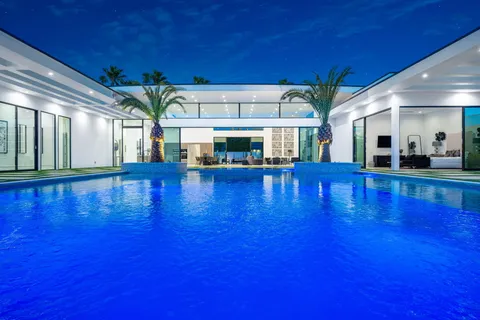 a view of swimming pool with seating area