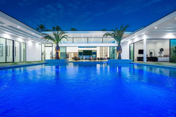 a view of swimming pool with seating area
