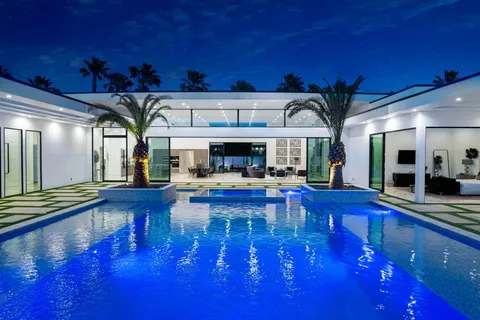 a view of swimming pool with seating area