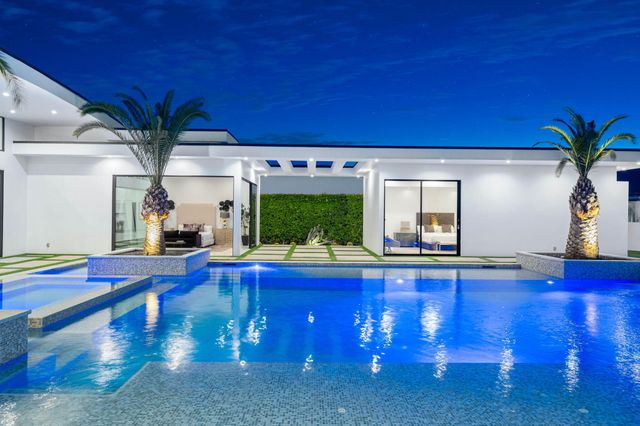 a swimming pool with outdoor seating