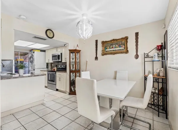 a view of a dining room kitchen and a window