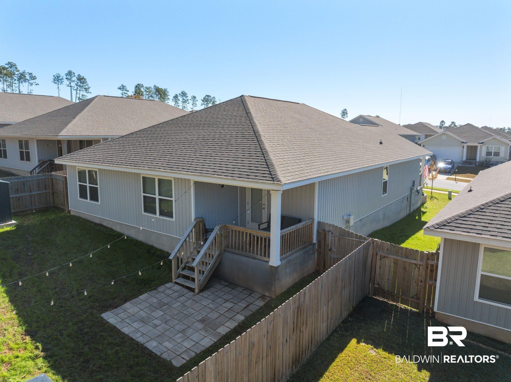 10306 Brodick Loop Spanish Fort, AL 36527 - Photo 28 of 35 Rear view of house featuring a yard and a patio