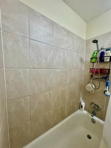 a bathroom with a tub and sink