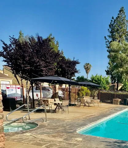 a view of a swimming pool with a patio