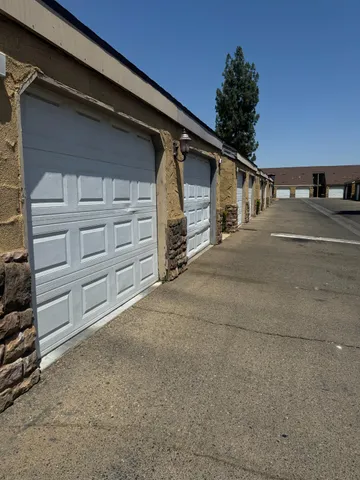 a view of parking space and garage