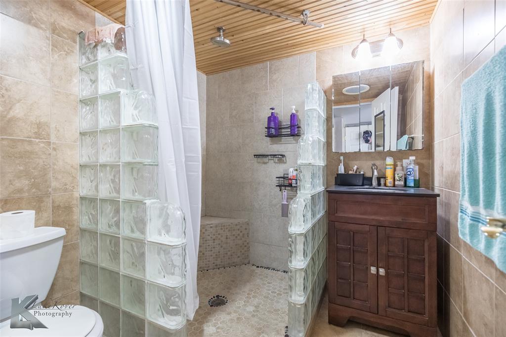 10001 County Road 379 Hawley, TX 79525 - Photo 17 of 39 a bathroom with a sink and a toilet