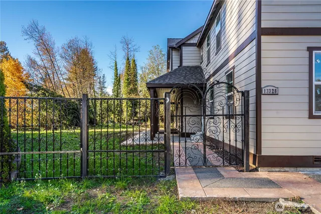 a front view of a house with a garden and porch
