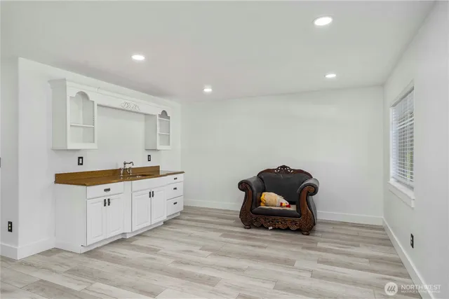 a bathroom with a shower toilet and sink