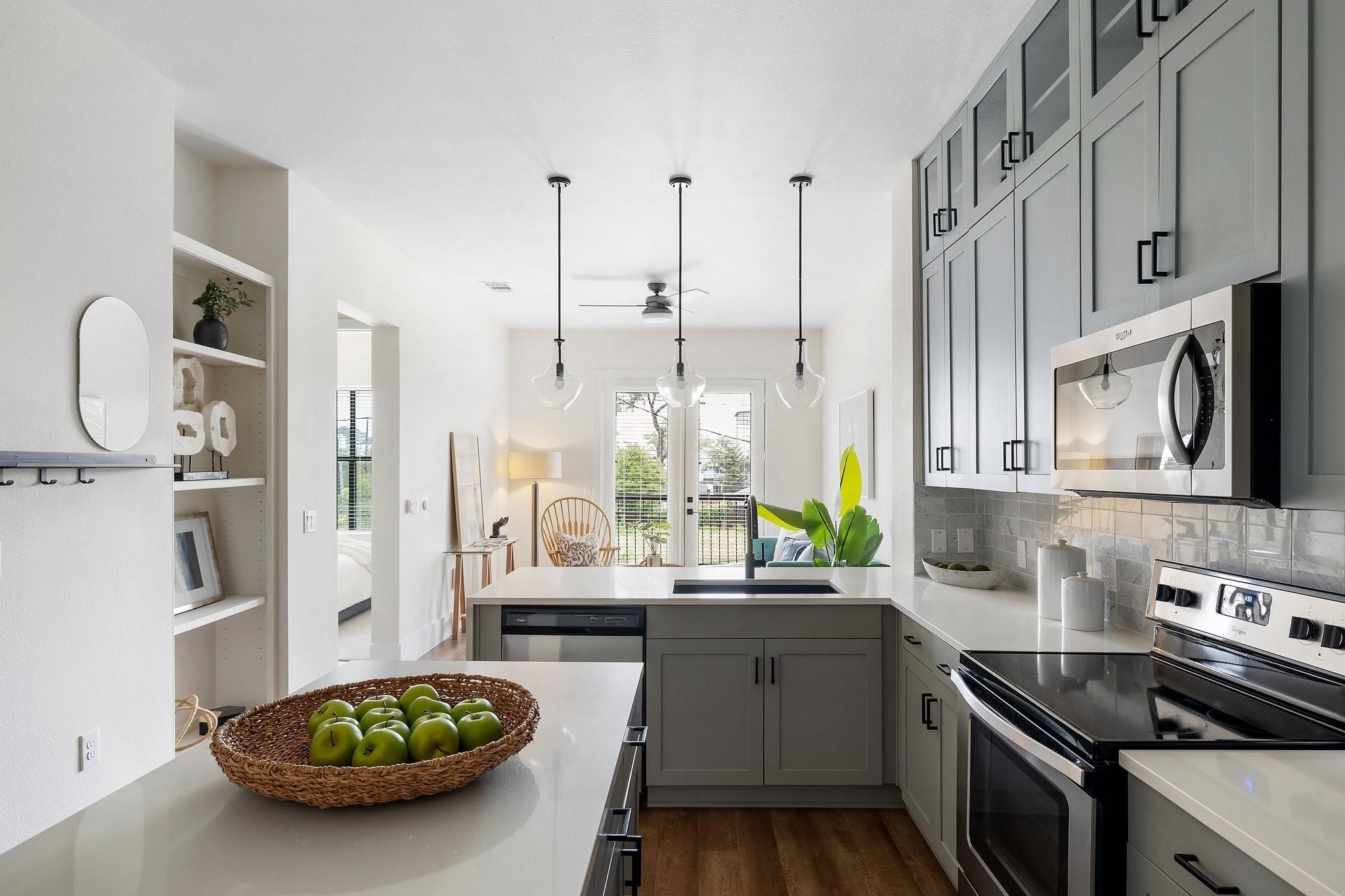 1508 Blodgett Street, Unit 503 Houston, TX 77004 - Photo 1 of 14 a kitchen with stainless steel appliances a sink a stove and a refrigerator
