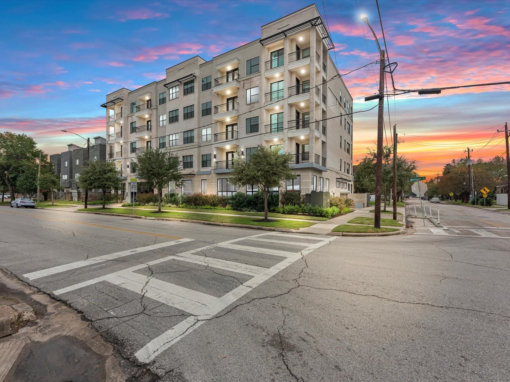 1508 Blodgett Street, Unit 503 Houston, TX 77004 - Photo 12 of 14 a view of a tall building next to a road