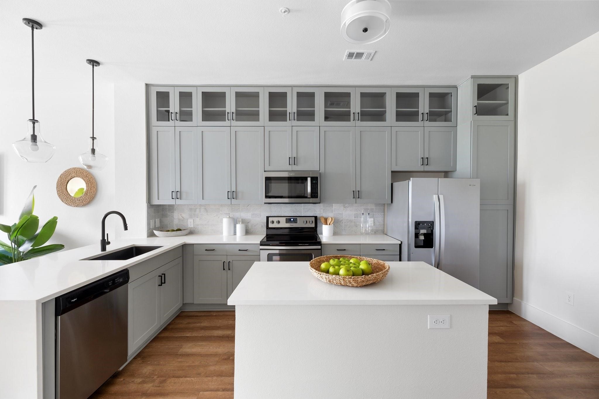 1508 Blodgett Street, Unit 503 Houston, TX 77004 - Photo 2 of 14 a kitchen with a sink a stove cabinets and counter space