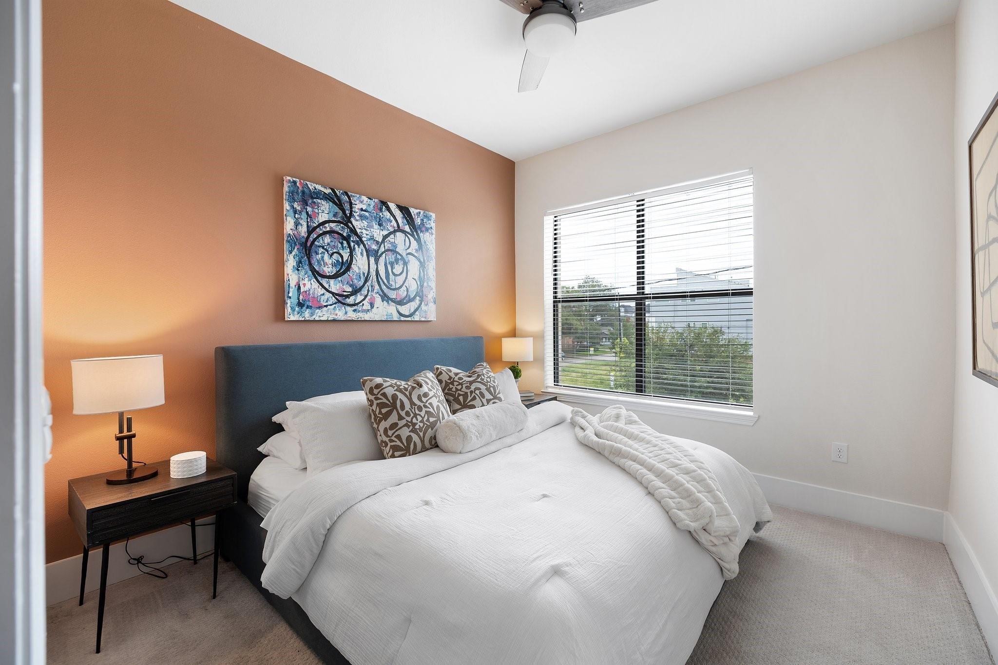 1508 Blodgett Street, Unit 503 Houston, TX 77004 - Photo 6 of 14 a bedroom with a bed and a window