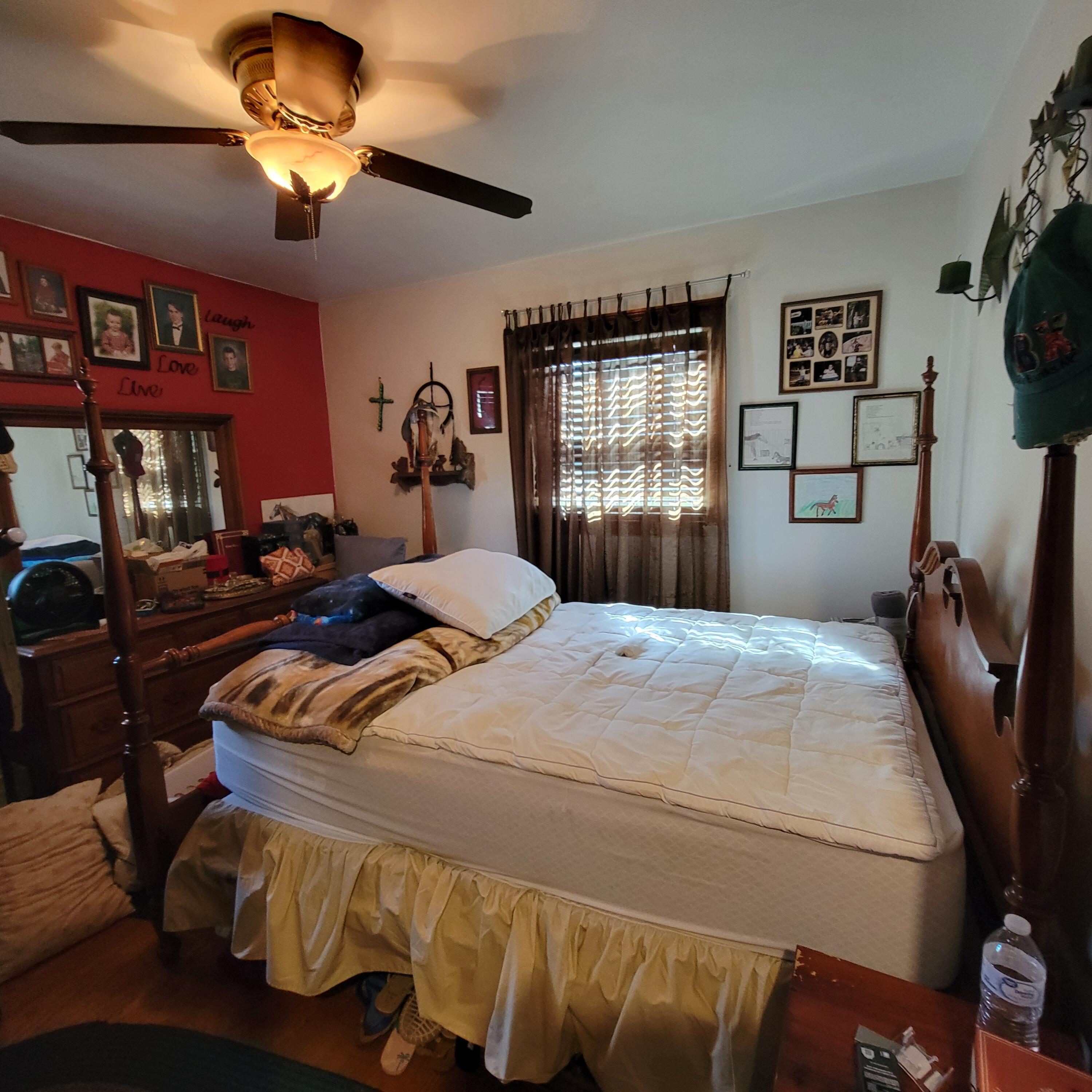 145 Whitten Street Rocky Mount, VA 24151 - Photo 11 of 19 a bedroom with double bed and a chandelier