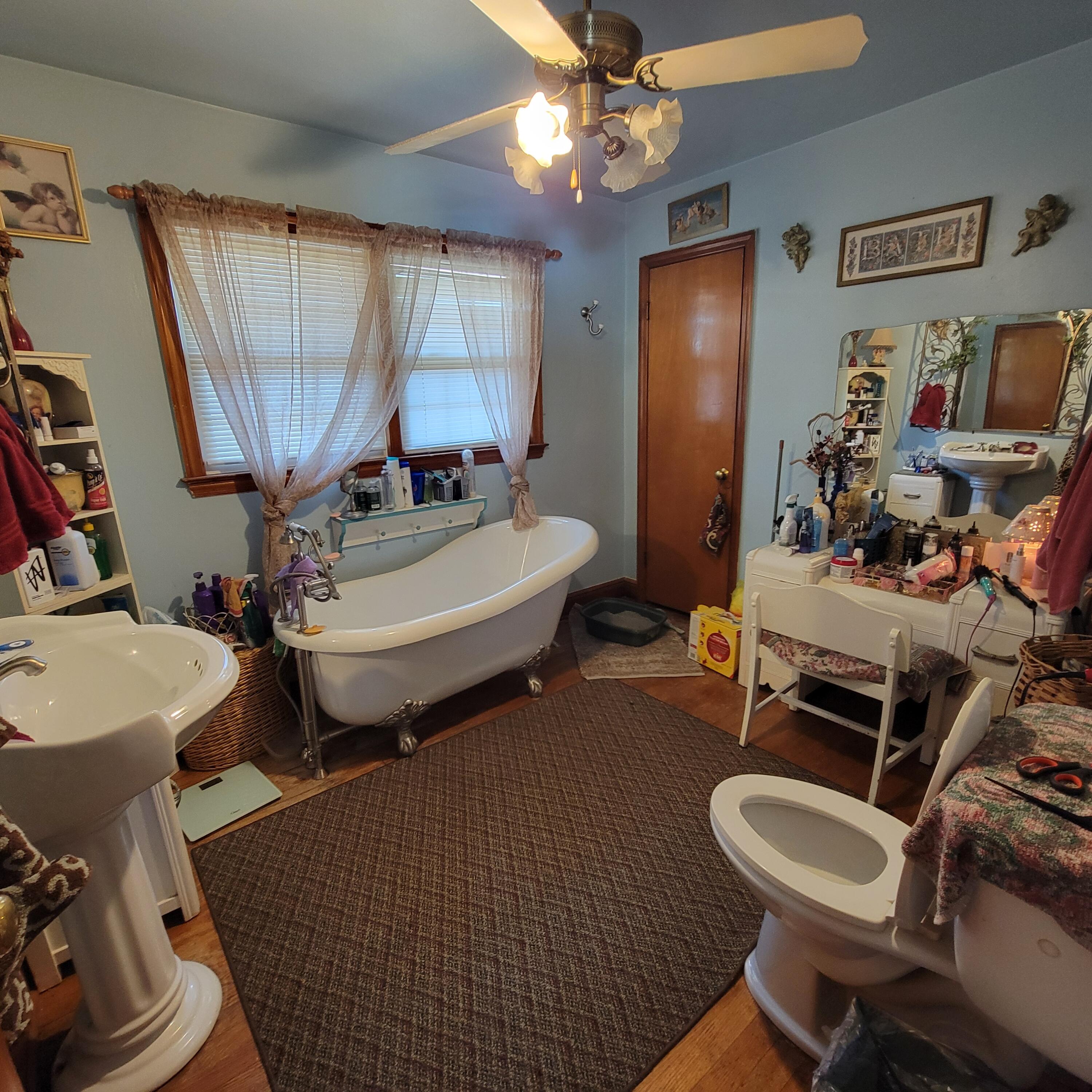 145 Whitten Street Rocky Mount, VA 24151 - Photo 14 of 19 a bathroom with a sink a toilet and a mirror