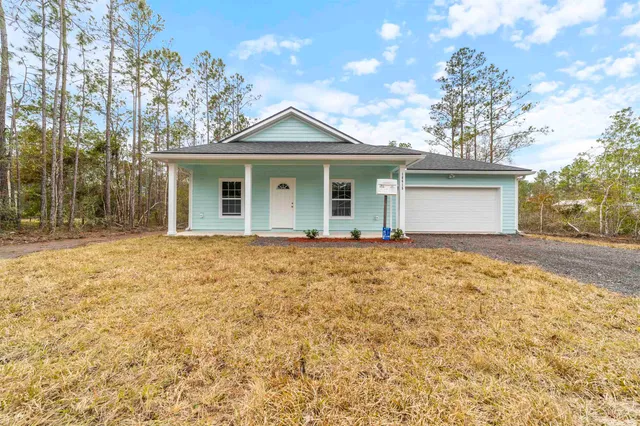 front view of a house with a yard