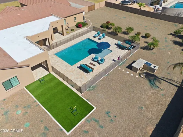 a view of a kitchen with cabinets and wooden floor