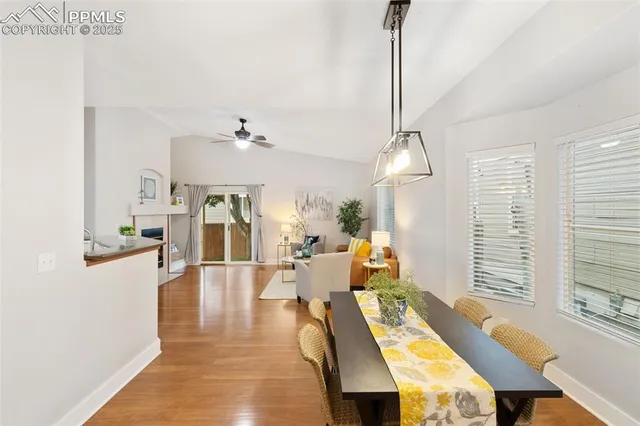 a view of a dining room with furniture window and wooden floor