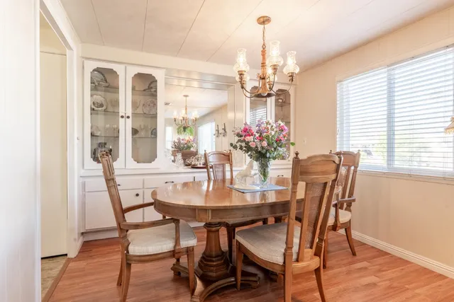 a view of a dining room with furniture window and outside view