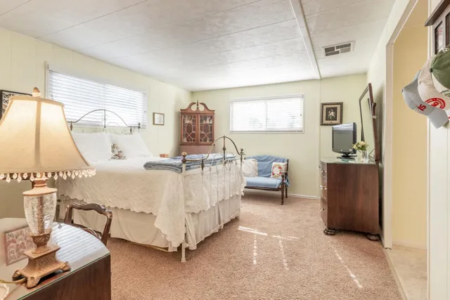 a bed room with a bed and a table