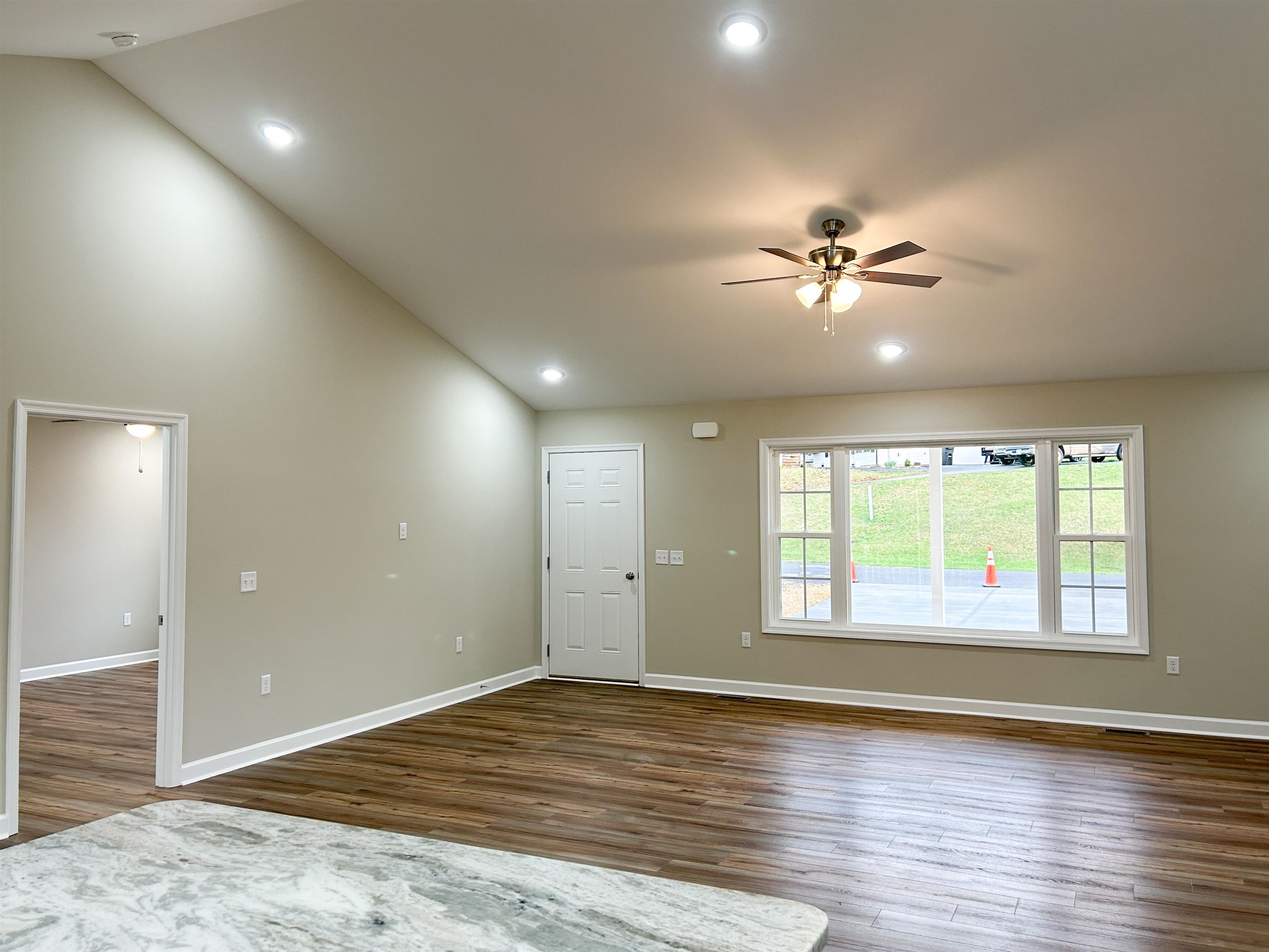 244 Locustdale Loop Shenandoah, VA 22849 - Photo 13 of 74 a view of an empty room with a window and wooden floor