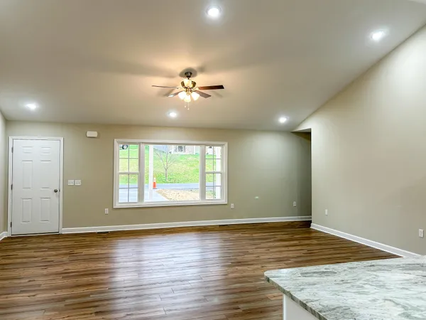 a view of kitchen with stainless steel appliances refrigerator microwave and stove