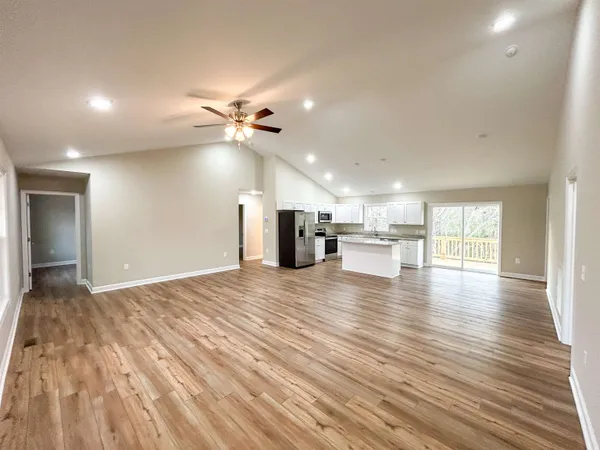 a view of a kitchen with a sink and cabinets