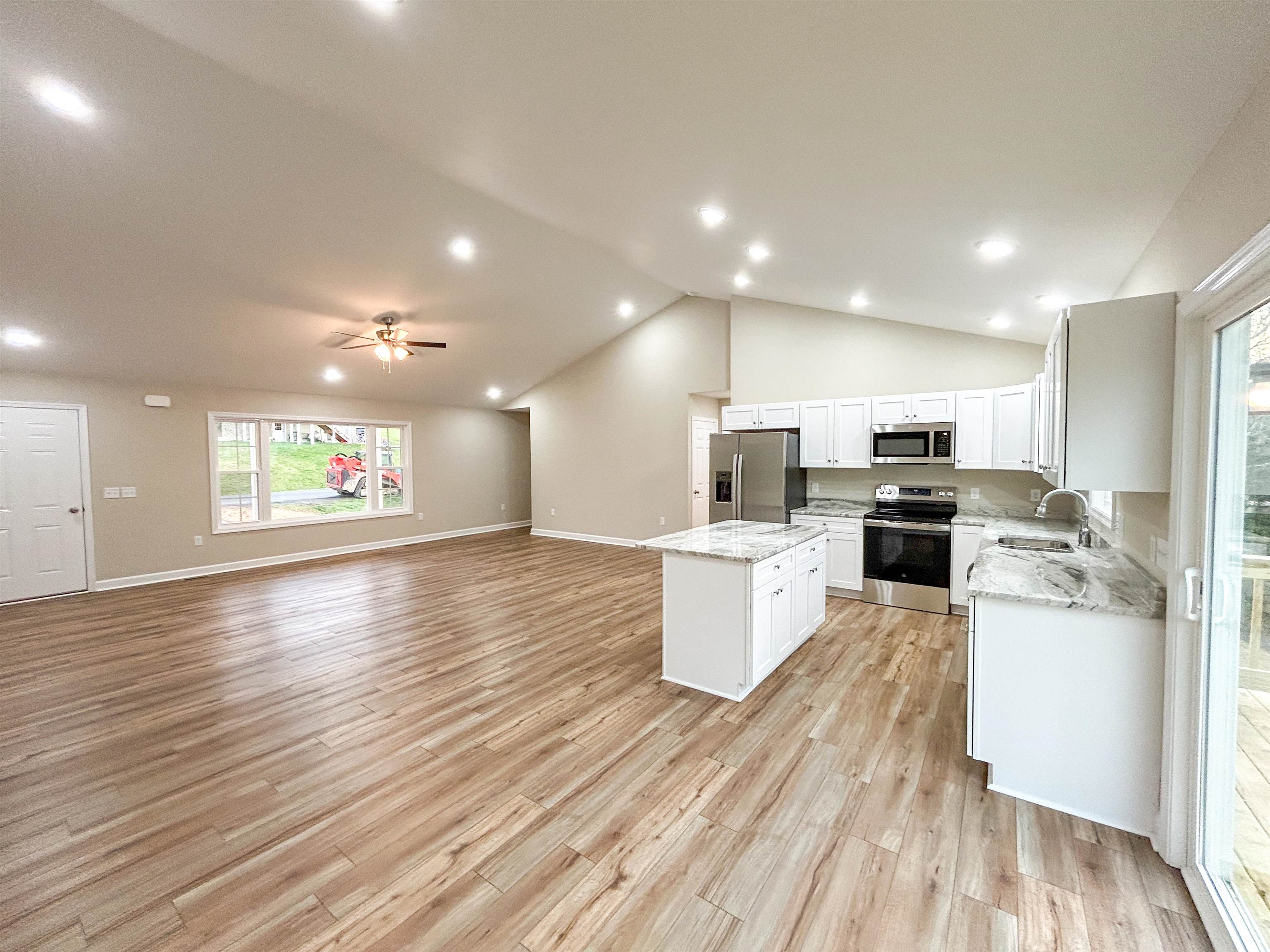 244 Locustdale Loop Shenandoah, VA 22849 - Photo 20 of 74 a view of kitchen with stainless steel appliances refrigerator microwave and stove