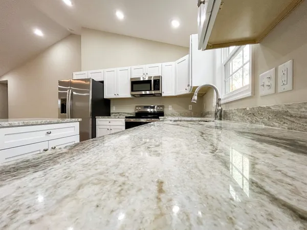 a bathroom with a glass shower door