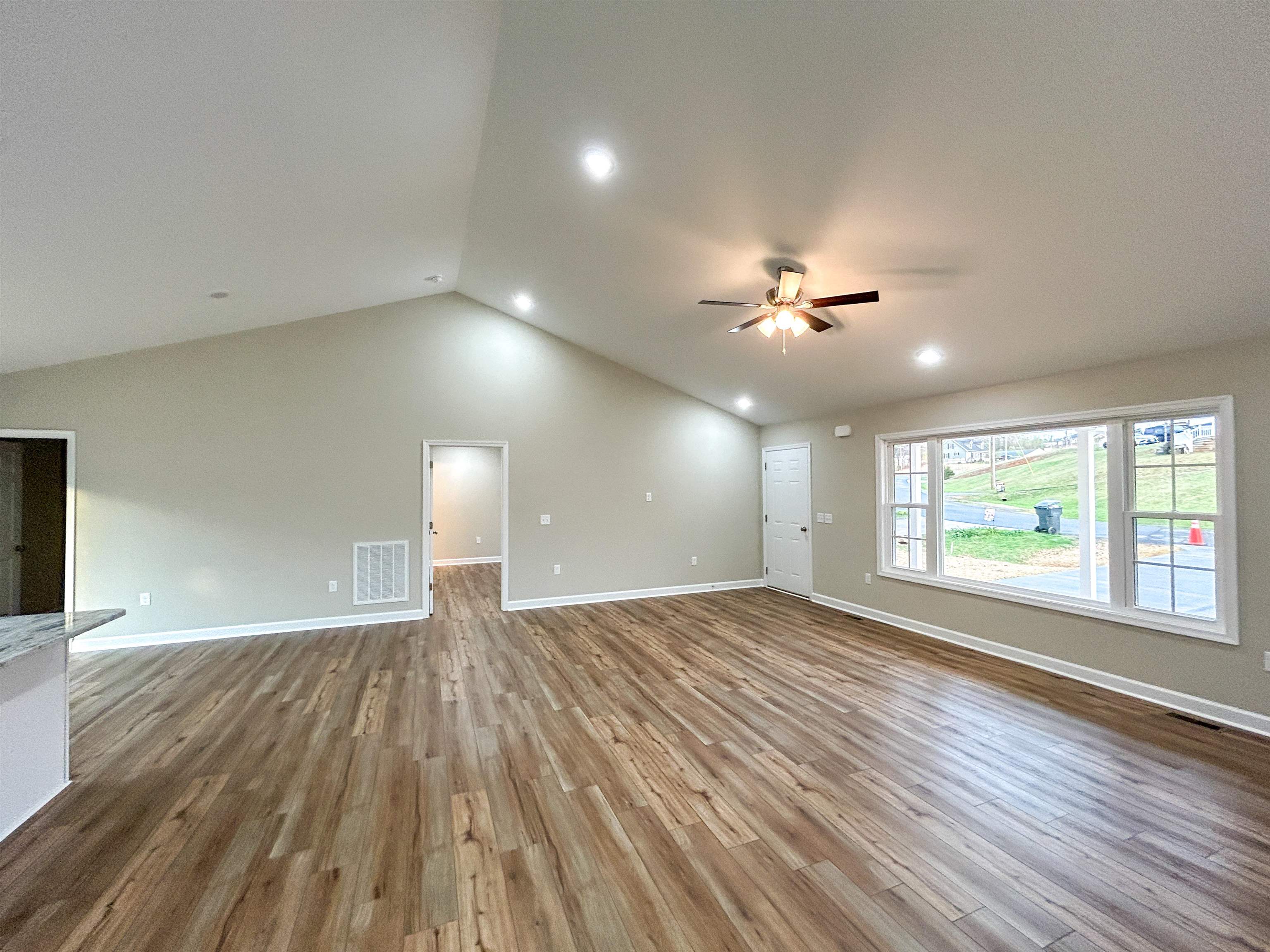244 Locustdale Loop Shenandoah, VA 22849 - Photo 36 of 74 a view of empty room with wooden floor and fan