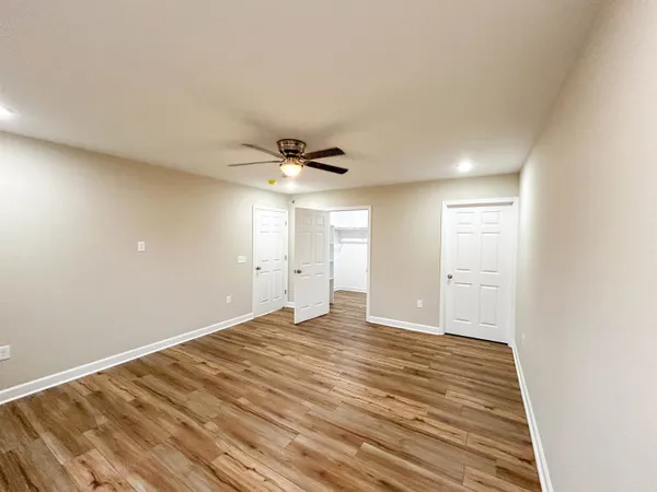 a view of balcony with wooden floor and fence