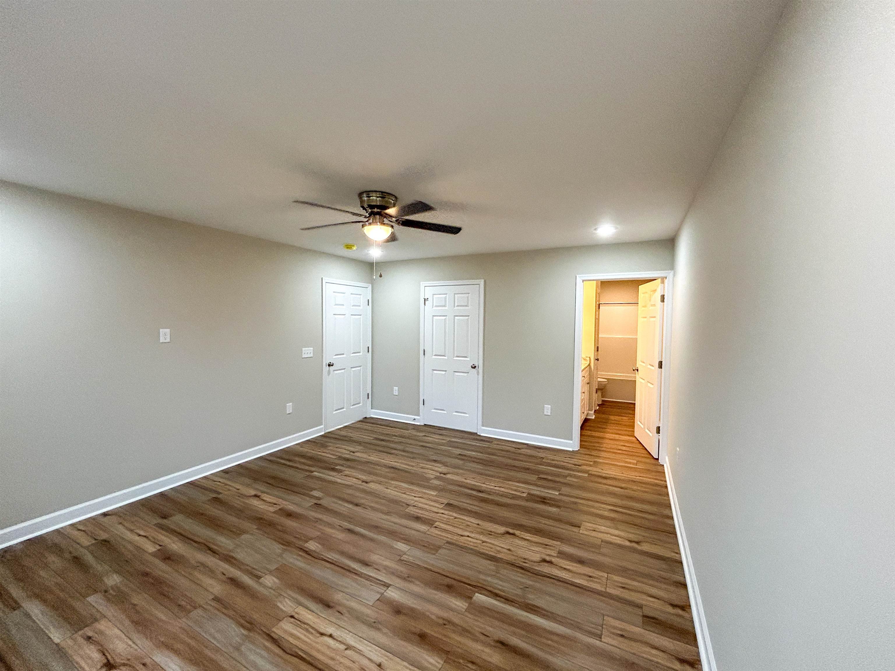 244 Locustdale Loop Shenandoah, VA 22849 - Photo 41 of 74 a view of an empty room with wooden floor and a ceiling fan