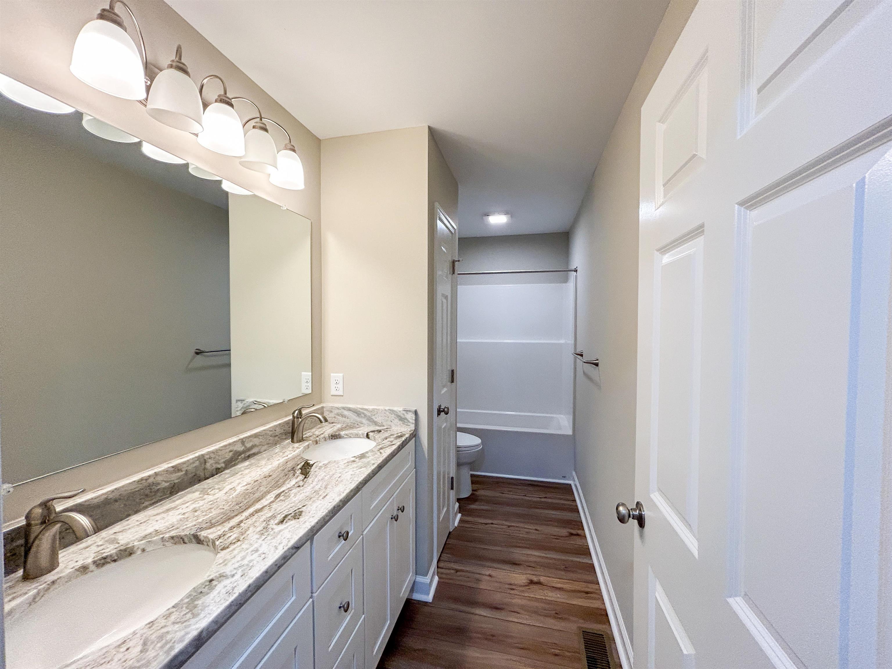 244 Locustdale Loop Shenandoah, VA 22849 - Photo 42 of 74 a bathroom with a sink and a mirror