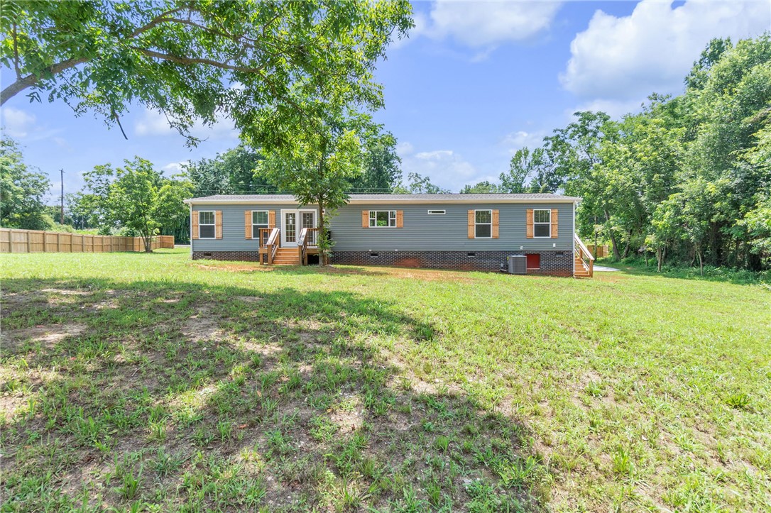 108 Old River Road Iva, SC 29655 - Photo 24 of 31 A sprawling lawn surrounds this single-story residence, offering ample outdoor space.