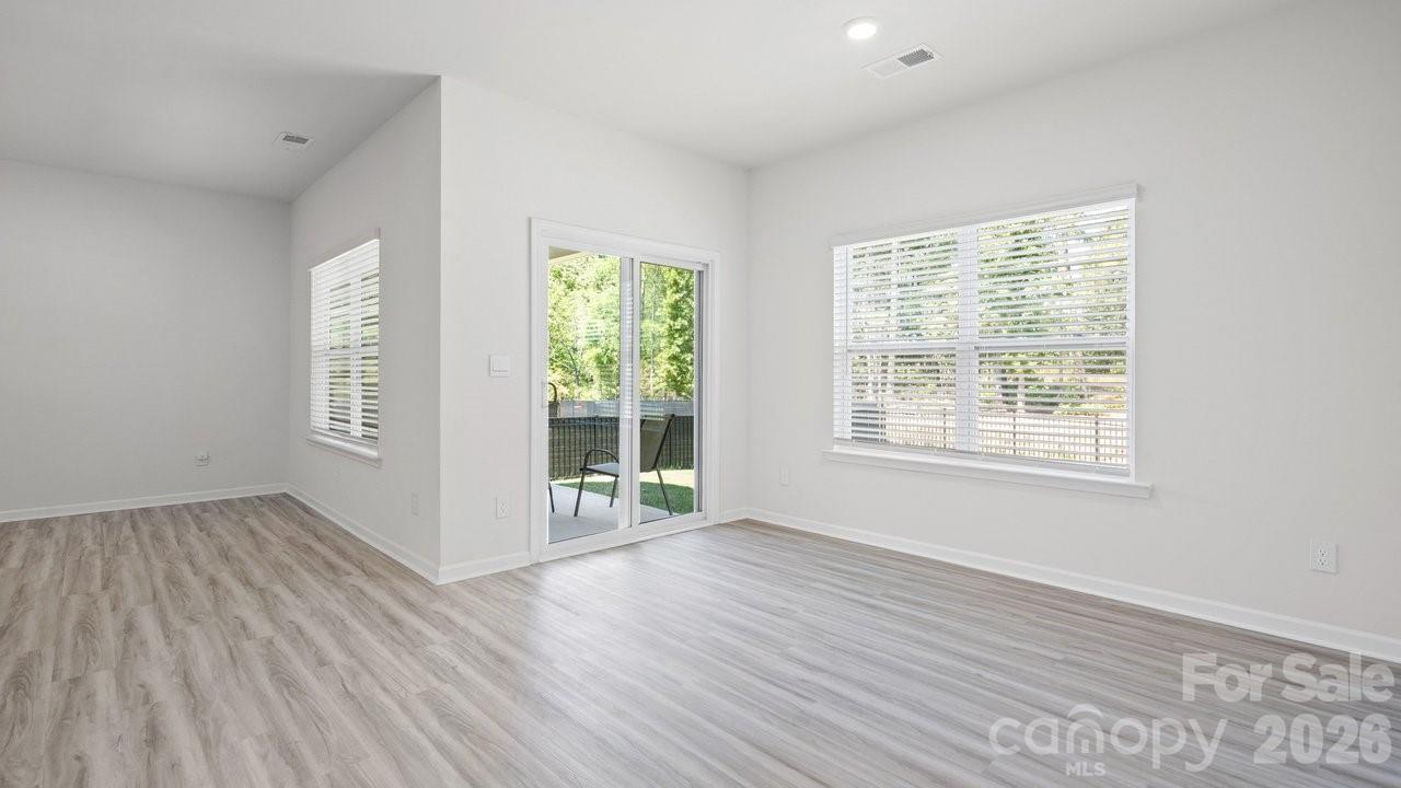 3688 Mercer Street Terrell, NC 28682 - Photo 28 of 34 a view of an empty room with wooden floor and a window