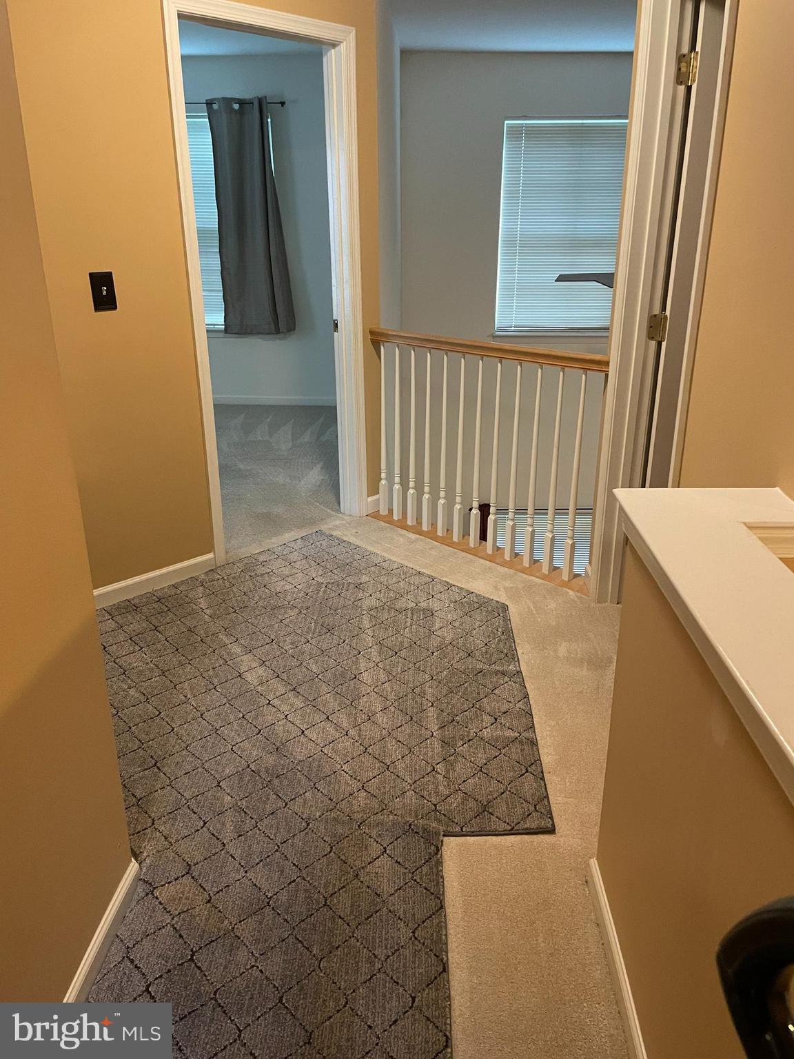 5 Carousel Circle Hershey, PA 17033 - Photo 14 of 14 a view of a hallway with wooden floor and staircase