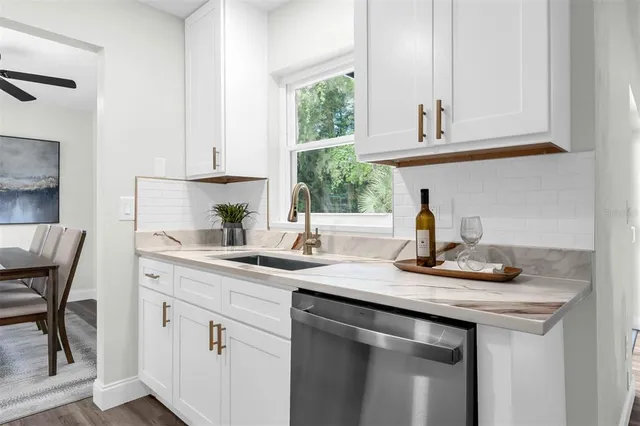 a kitchen with sink and window