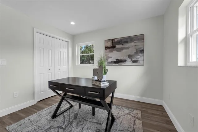 a workspace with furniture and window