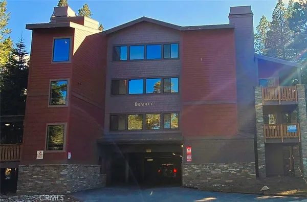 a front view of a brick building with many windows